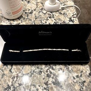 This is a 10k gold diamond bracelet.